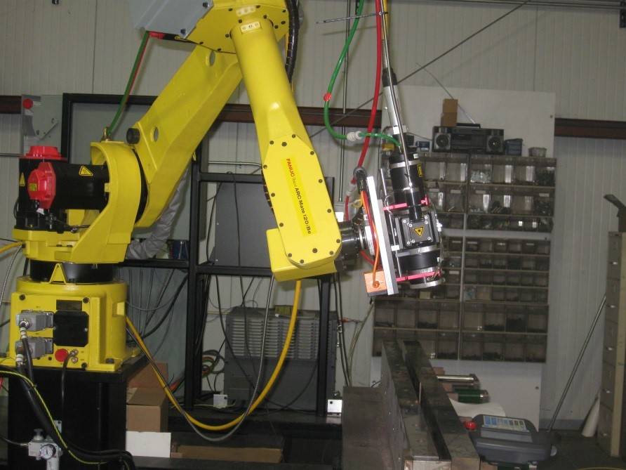 Integrated robot laser heat treating